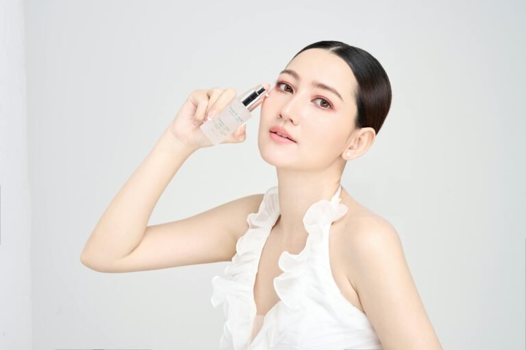 Woman applying niacinamide 5% serum on face gentle morning skincare routine